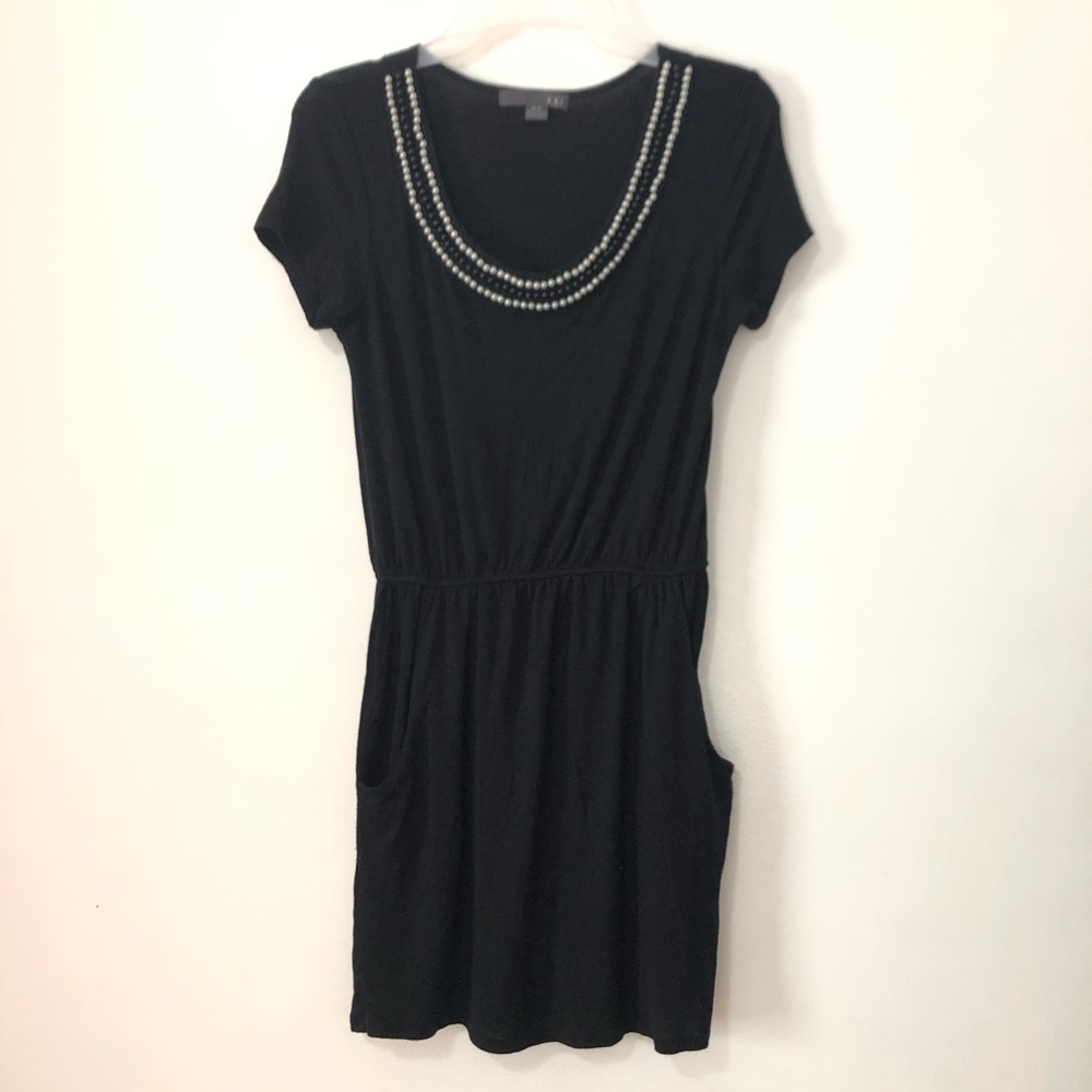 Black pearl-collar dress with pockets